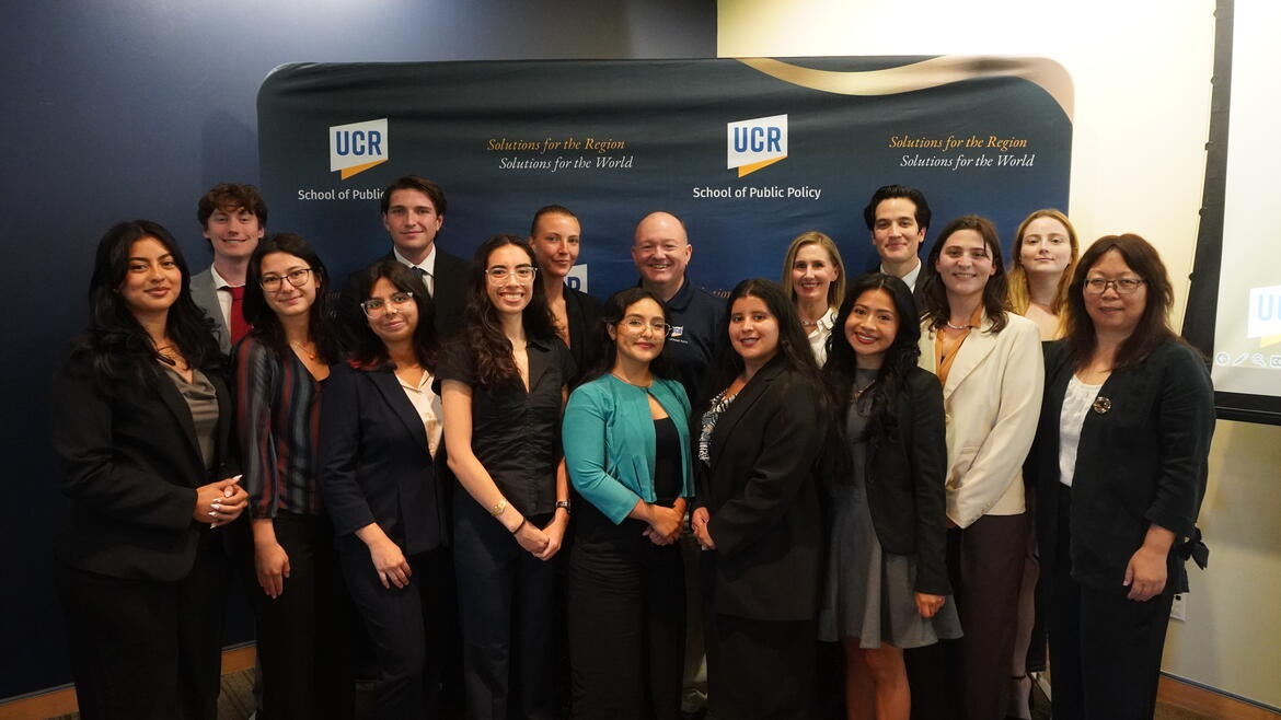 A group photo of the 2026-2027 Randall Lewis Policy Fellows with Justine Ross and Dean Mark Long.