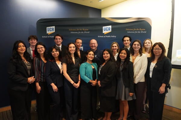 A group photo of the 2026-2027 Randall Lewis Policy Fellows with Justine Ross and Dean Mark Long.